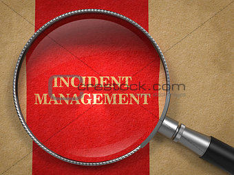 Incident Management - Magnifying Glass on Old Paper.
