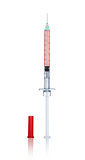 syringe with needle and cap on an isolated white background