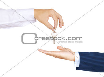 Human hand holding house key