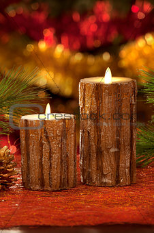 electric candles with christmas decorations in atmospheric light