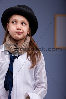 little girl thinking perplexed in a strange costume