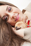 young beautiful woman loving her puppy
