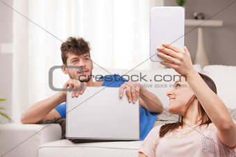 wife showing a tablet to his husband