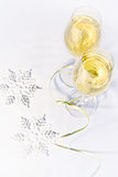 Two glasses of wine and snowflakes
