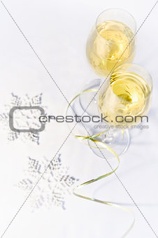 Two glasses of wine and snowflakes