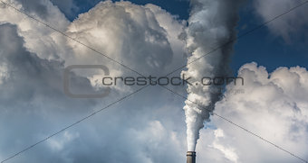 Heavy smoke spewed from coal powered plant smoke stacks