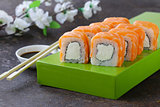 Sushi roll with red salmon and philadelphia cheese