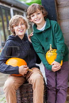 Two Happy Boys Brother With Pumpkins