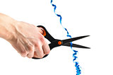 Cutting a blue ribbon with scissors isolated in white background