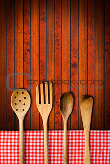 Wooden Kitchen Utensils on Wooden Background