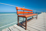Wooden bench on tropical jetty