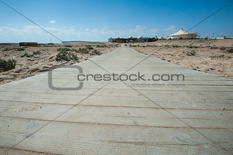 Wooden walkway across sand dune