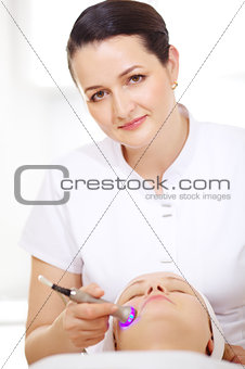 Cosmetician making lifting procedure