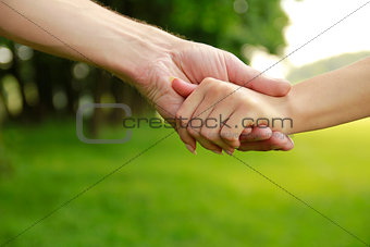 two hands in love couple on nature