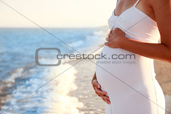 pregnant woman on the beach