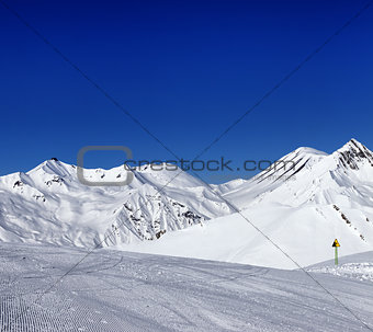 Ski slope and warning sign