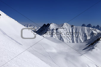View on snowy off piste slope with trace from avalanche