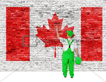 Professional house painter covers wall with flag of Canada