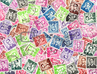 King Baudouin. Background of postage stamps