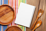 Wood kitchen utensils with notepad for copy space