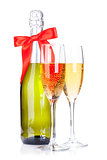 Two champagne glasses and bottle with ribbon