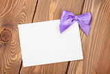 Greeting card with purple bow