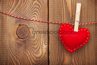 Red toy valentines heart on rope