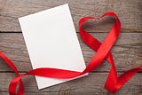 Valentines day heart shaped red ribbon and greeting card
