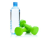 Two green dumbells and water bottle. Fitness and health