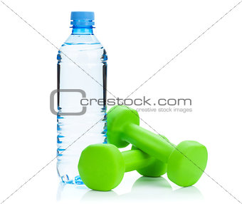 Two green dumbells and water bottle. Fitness and health