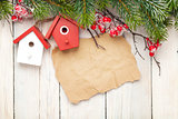 Christmas wooden background with fir tree and birdhouse decor