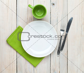 Empty plate, cup and silverware