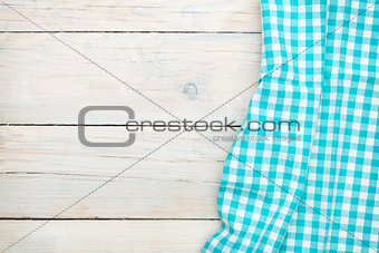Blue towel over wooden kitchen table