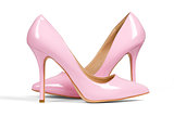 A pair of pink women's heel shoes
