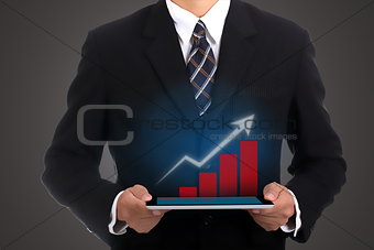 Businessman holding touch pad 
