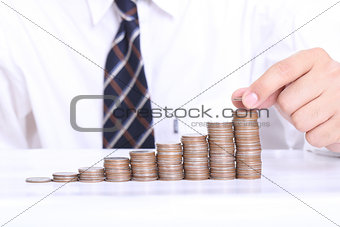 Business women put coin stack money