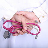 Medical doctor holding stethoscope