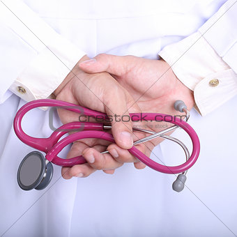 Medical doctor holding stethoscope