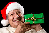 Elderly Man with Santa Cap And Green Wrapped Gift