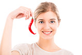 Beautiful woman holding a red chilli pepper