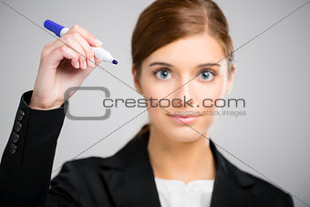 Businesswoman drawing on a glass board