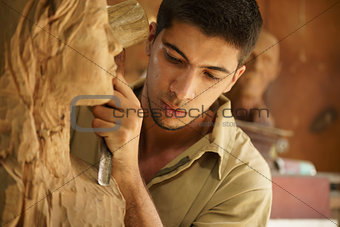 Sculptor young artist artisan working sculpting sculpture