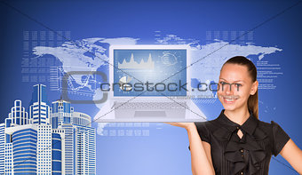 Beautiful businesswoman in dress smiling and holding latop with graphs. Buildings, world map, text rows
