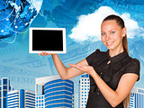 Beautiful businesswoman holding hand tablet with blank screen. Buildings, money and Earth as backdrop