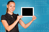 Beautiful businesswoman in dress holding tablet pc. Graphs and figures as backdrop