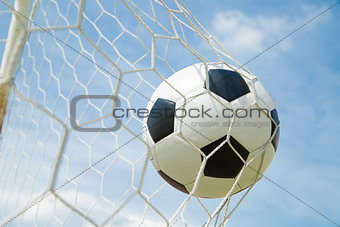 Soccer ball in the goal after shooted 