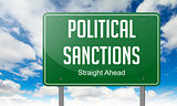 Political Sanctions on Highway Signpost.