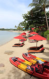 bright colored beach with kayaks