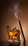 Glass of whiskey and cigar