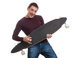 Man holding longboard in his hand